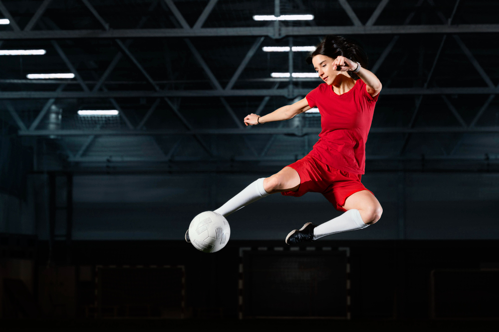 woman jumping kick ball