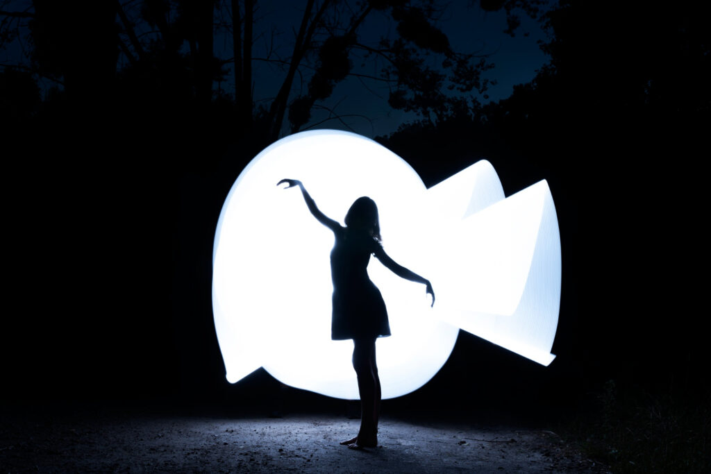 full shot woman with white light painting