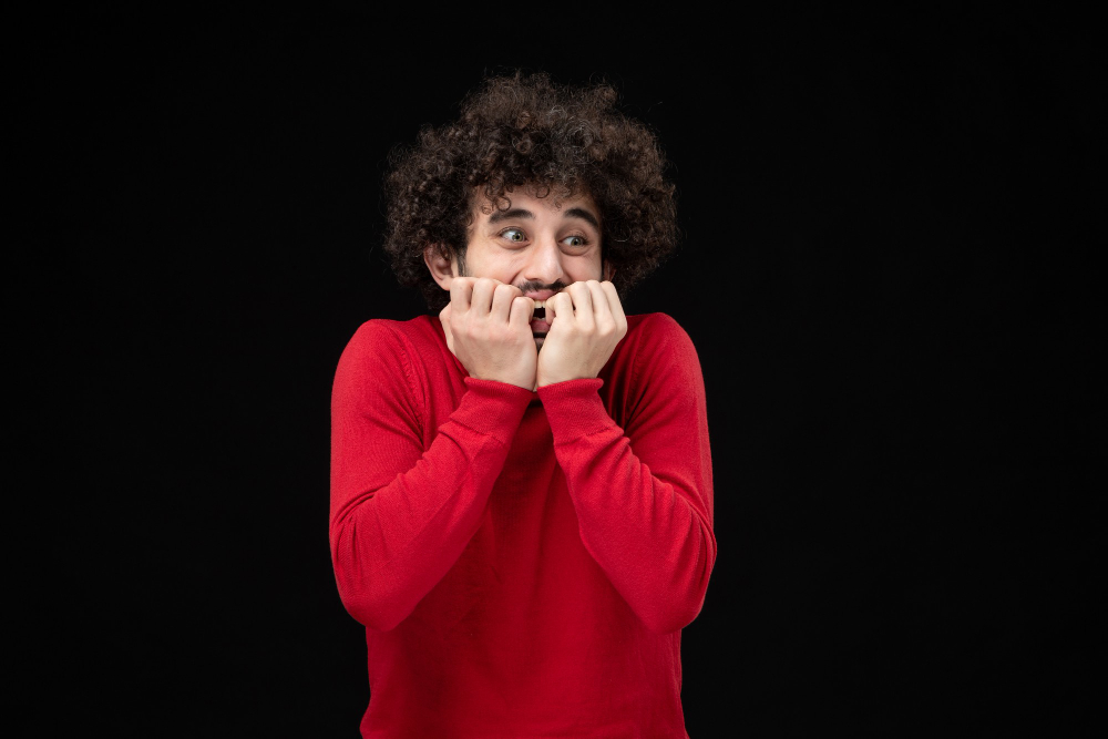 front view young male red sweater black wall